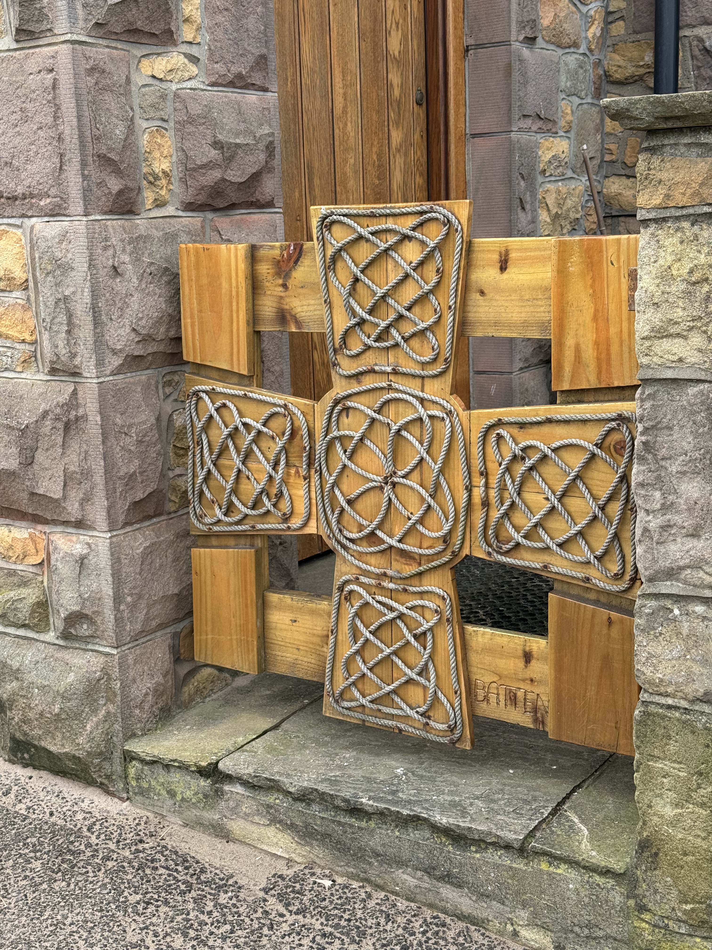 knotted rope cross signifies our uniting in Christ.